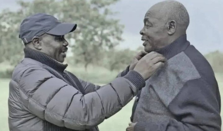 Undated photo of late Speaker Jacob Oulanyah adjusting his father Mzee Nathan Okori's sweater collar, symbolizing their close bond; Mzee Okori died March 20, 2026, four years after son's passing in Uganda news.